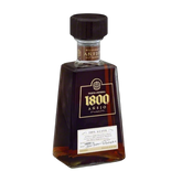 304 Liquor 1800 Anejo Tequila bottle with dark amber liquid, featuring a signature trapezoidal glass design.