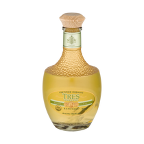 Detail close-up of Tres Generaciones Reposado Tequila bottle with cork stopper and gold accents