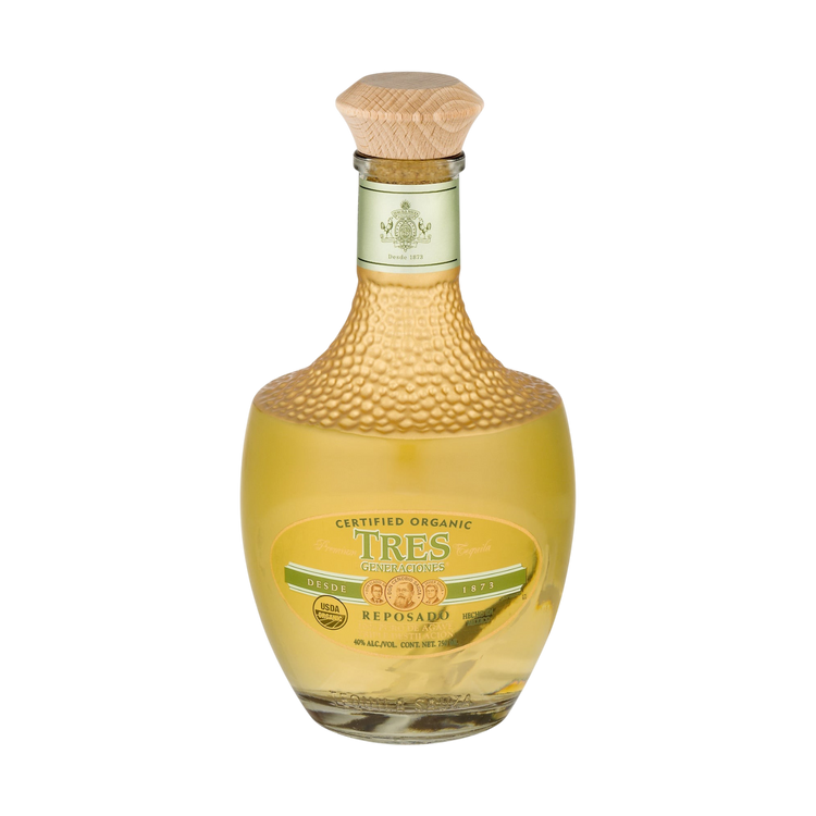 Detail close-up of Tres Generaciones Reposado Tequila bottle with cork stopper and gold accents