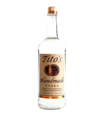 Front view of Tito's Handmade Vodka bottle with a clear body and brown label on a white background