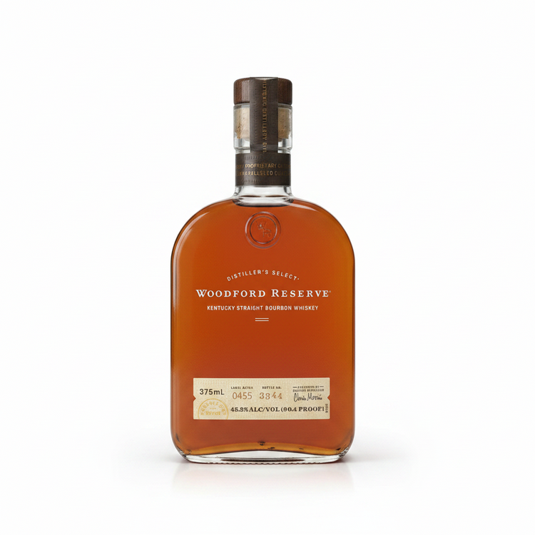 Front view of the Woodford Reserve bourbon bottle with a curved glass design and wooden cap.